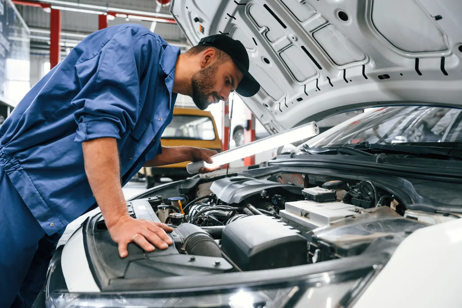 Mechanic working on an engine bay