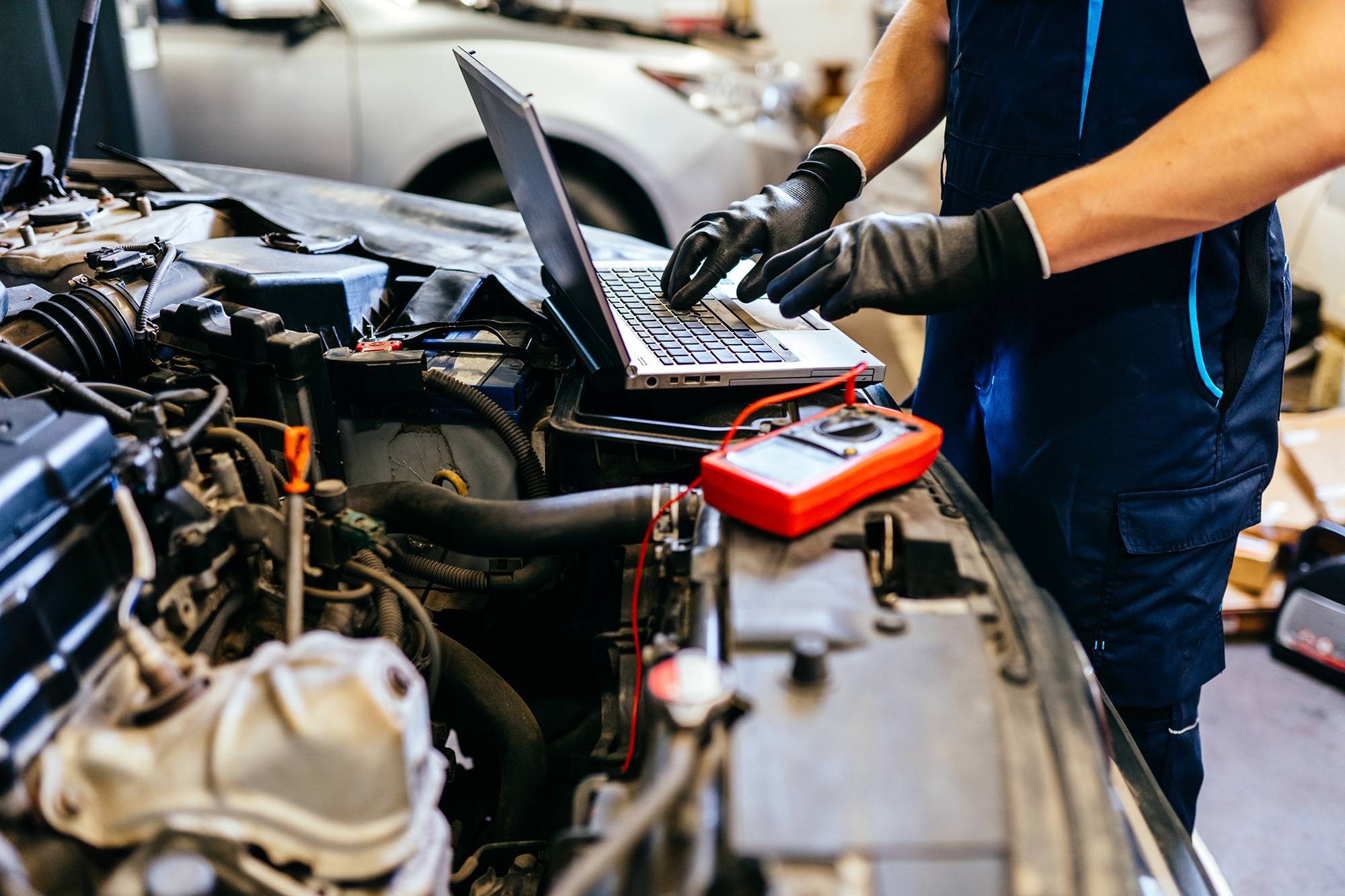 Digital vehicle inspection report open on a laptop in the shop