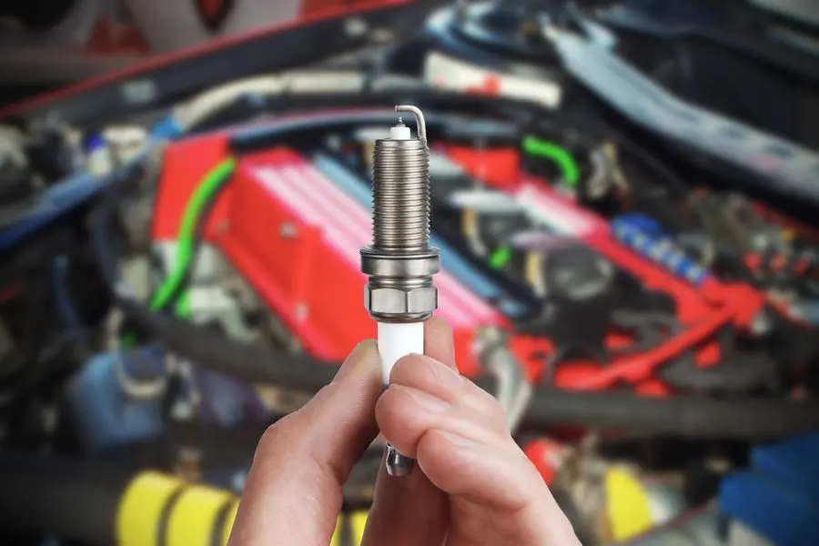 Engine tune-up service being carried out on a vehicle